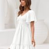Women's Flowy Casual Mini Dresses 2025 Summer Graduation Smocked V Neck Vacation Dress Dress with Pockets